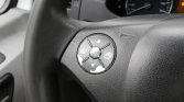 Circular steering-wheel control pad with four directional arrows and a center button (multipurpose/menu navigation). It’s on the left side of the wheel.