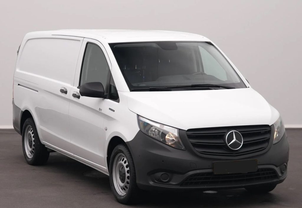Front-left view of a white Mercedes-Benz cargo van with black bumper and grille in a studio setting