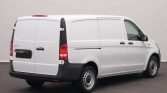 Rear three-quarter view of a white Mercedes-Benz Vito cargo van with closed rear doors.