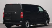 Rear and side view of a black Peugeot e-Expert van with tinted rear windows in a studio setting, showing the back doors and tail lights