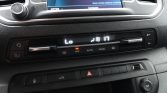 In‑car climate control panel showing low temperature, 17° fan icon active, A/C on, AUTO and defrost buttons visible